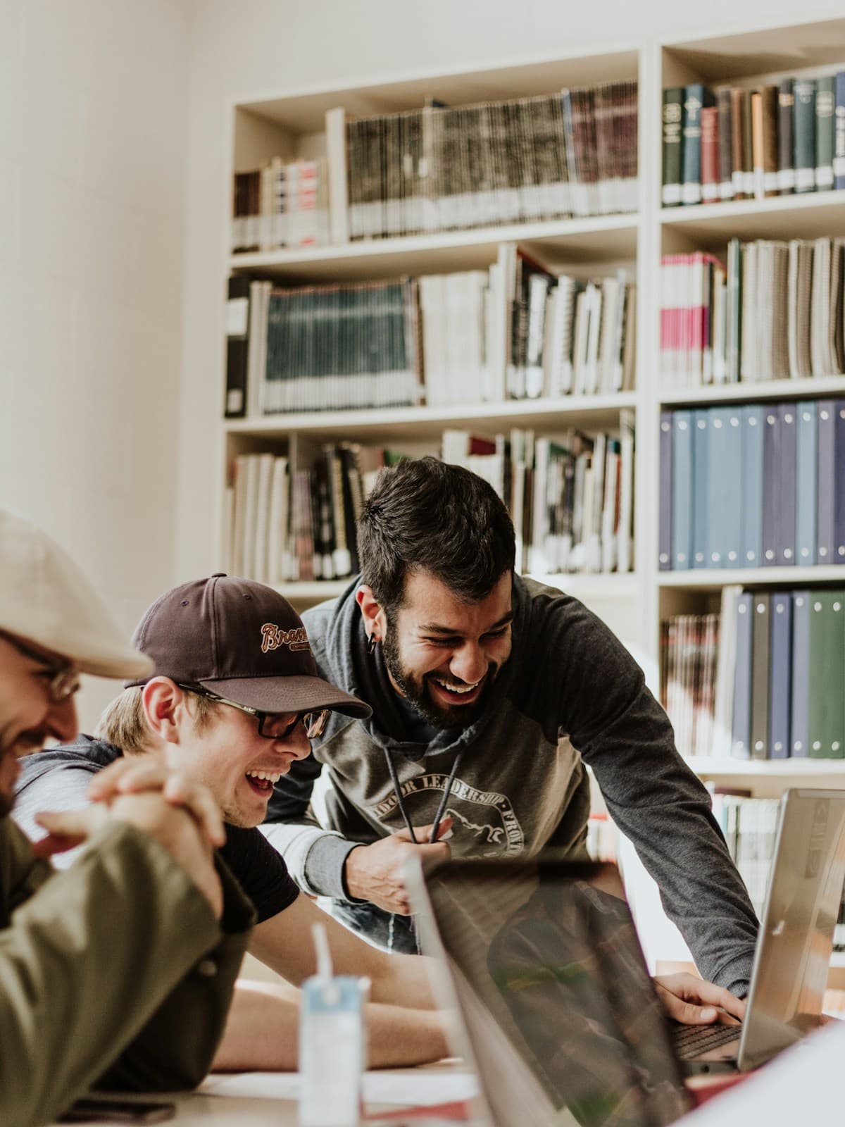 Adults reviewing information together in a library